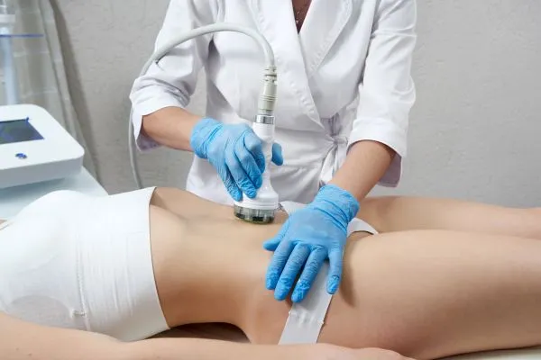 Lost the Weight but Not the Loose Skin? 2 woman having HIFU treatment on her stomach to combat loose skin Skegness following weight loss